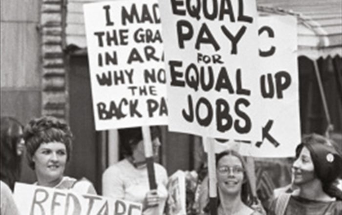 Section of book cover showing women holding placards